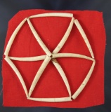 Set of 12 Dentaliashell beads found near the Columbia River which are lightly glued to red fabric.