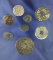 Group of eight metal buttons and coins found on the Columbia River by Dewey Schmid.