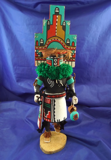 Ornately crafted 15" tall Kachina that is signed on bottom.