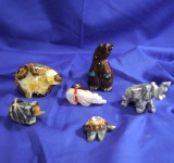 Set of six assorted stone and wood carvings, several are very ornate & signed Zuni fetishes.