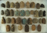 Large group of approximately 34 Buddhist images made from clay recovered in Tibet.