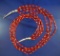Attractive multi-stand red and white bead necklace.