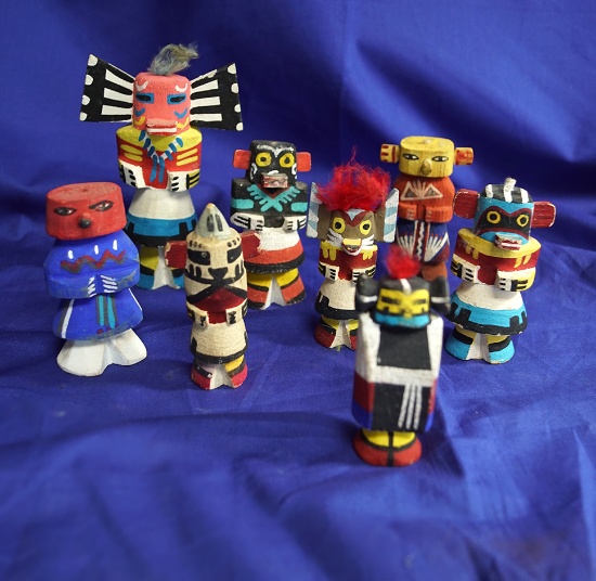 Set of 8 carved and painted Southwestern wooden figures.