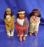 Set of 3 Skookum Dolls: 2 are contemporary plastic, one is vintage wood.