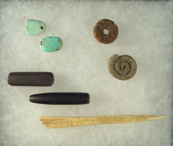 Group of assorted artifacts found near Witch Well, Arizona including turquoise pendants