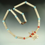 Necklace made from clay pipe stems and contemporary beads that makes a nice display item.