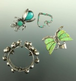 Assorted southwestern Indian jewelry including necklace pendant, brooch and hair class.