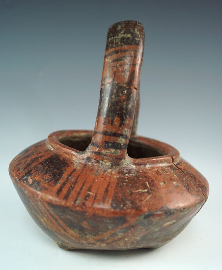 Handled "basket" bowl from the Narino culture, Columbia, South America. Broken and glued.
