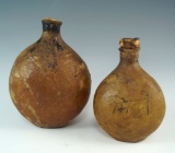 Pair of very old Arabic corked animal scrotum bottles. Largest is 5