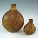 Pair of very old Arabic corked animal scrotum bottles. Largest is 4 3/4