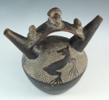 Sican/Chimu culture double spout pottery vessel featuring a seal, frogs, and Lord Nallape