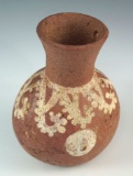 Breast effigy octopus bottle with a drilled top. Moche culture, solid condition, Peru.