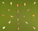 Group of 20 nice assorted arrowheads found in the High Plains region glued to a board.