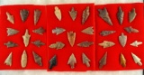 Large group of approximately 33 African Neolithic arrowheads glued to felt, largest is 1 5/8