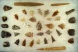Nice frame of assorted artifacts - Dakotas - including scrapers, arrowheads and bone tools.