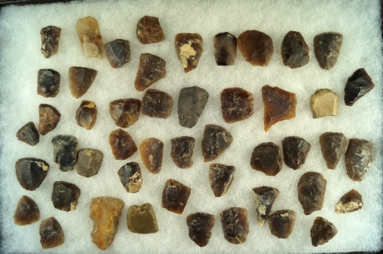 Large group of mostly Knife River Flint scrapers and tools found in the Dakotas.