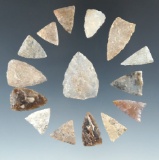 Set of 15 triangular Plains arrowheads made from various materials, largest is 1 1/8