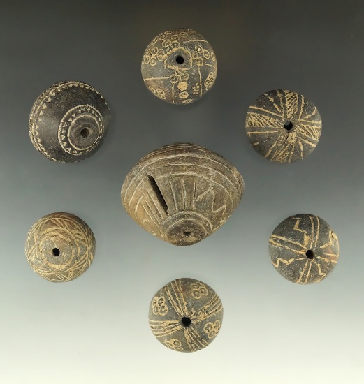 Set of 7 Very ornate Spindle Whorls found in Mexico, largest is 1 7/8" Diameter.