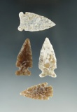 Set of four heavily patinated arrowheads in very nice condition found in High Plains region.