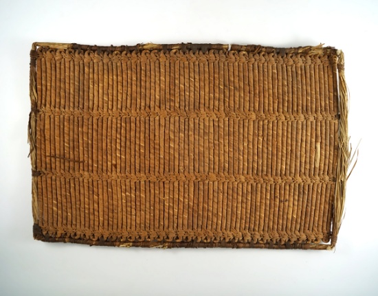 16" tall by 11" wide woven African mat that would make a nice wall display.