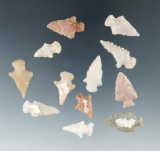 Set of 12 arrowheads made from nice material which were glued to a board, largest is 1