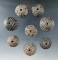 Set of eight highly decorated clay spindle whorls from Mexico.