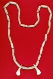 Very nice bone bead necklace with two elk teeth recovered from Union Co., Illinois. Ex. Richard Shiv