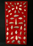 Old display board with many glued on arrowheads and knives from Tennessee. Largest is 3 1/2