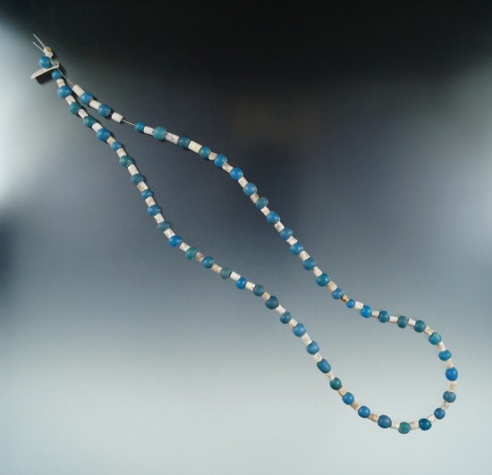 22" strand of beads including blue rounds and wampum found in New York.