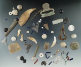 Surface recovered artifacts: bear tooth, Jews harp, Jesuit buttons and flints - various sites in NY.