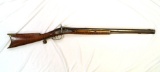 Woman's (shorter stock)  muzzleloading rifle with a curly maple stock and a James Gulcher lock.