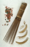 Display of Bamboo Comb, Beads and Shell. Area of origin unknown.