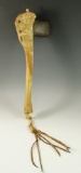 Celt hafted in a contemporary bone handle. Pictured in Who's Who #3.
