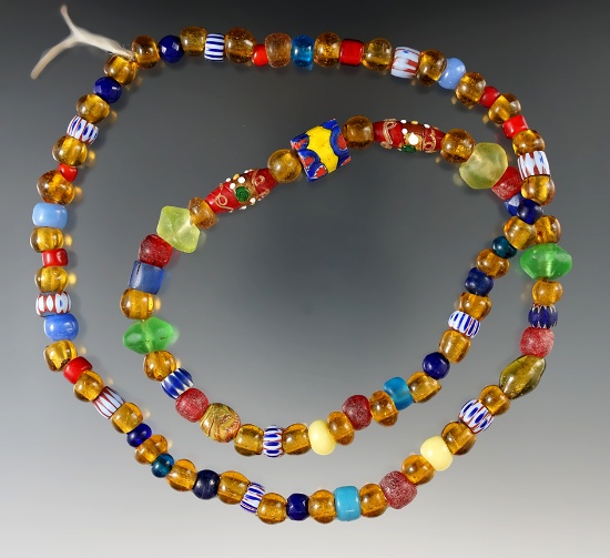 26" Long strand of assorted beads from various time periods.