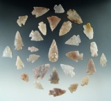 Group of 20 eighths arrowheads found in Colorado made from attractive semi translucent materials.