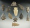 Group of 12 assorted arrowheads and knives found in New York, one has a restored ear.