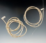 Two large strands of white seed beads, one is 33 1/2
