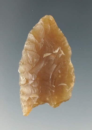1 3/4" Paleo Folsom made from Knife River Flint with ancient damage to one ear - Brookings Co., SD.