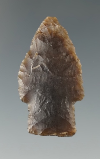 1 1/2" Scottsbluff made from Knife River Flint with a fire-pop on reverse side. Found in Eastern SD.