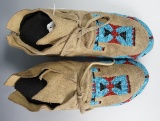 Pair of nicely beaded moccasins from the mid-1900's that display very well.