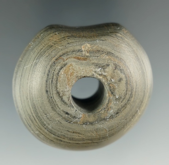 1 7/8" Archaic Flattened Ball Bannerstone with a fluted base found in Van Wert Co., Ohio.