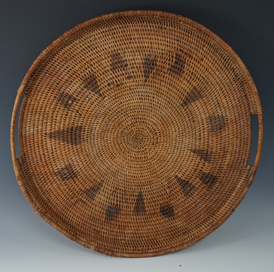 Large 17 1/4" diameter beautifully woven tray in excellent condition.