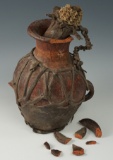 Unique Pre-Columbian polychrome pottery vessel with original leather wrap and stopper.