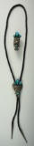 Set of silver and turquoise Southwestern jewelry including a Bolo tie and a matching ring.