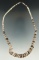 Contemporary shell necklace that is nicely made and attractive.