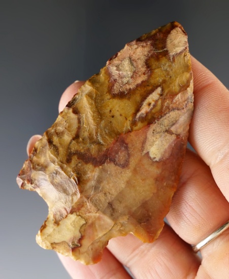 2 3/4" highly colored Adena made of exotic orange, red, and cream flint. Found in Ross Co., Ohio.