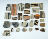 Group of 26 anciently salvaged pottery shards sanded into various different shapes. New Mexico.