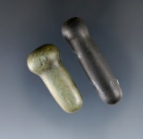 Pair of polished stone facial ornaments, largest is 1 11/16