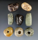 Set of eight nicely polished assorted Pre-Columbian stone beads, one has a human face effigy on it.