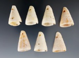 Set of seven well styled drilled shell dangles/ornaments found at a site in New Mexico.
